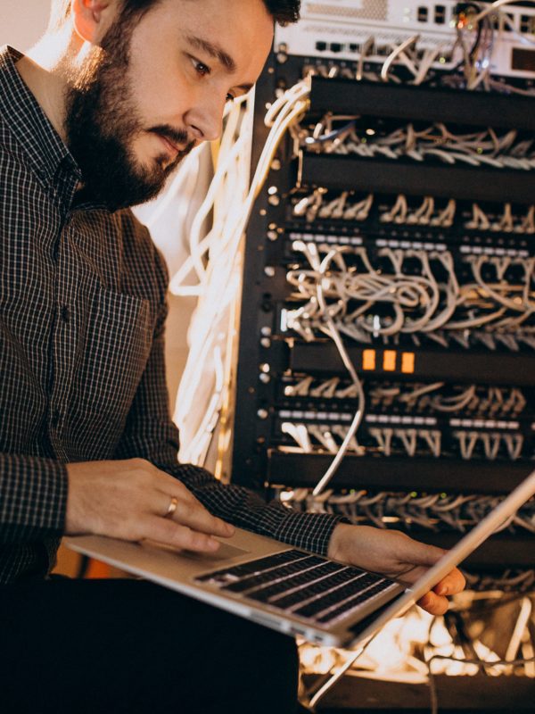 Young it service man repairing computer